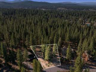 Discover this prime parcel nestled amidst a dense forest of mature pine trees, offering unparalleled privacy and natural beauty.