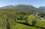 Experience breathtaking mountain views and serene riverfront living in this stunning property.