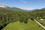 Discover this stunning property nestled amidst a lush forest with breathtaking mountain views.