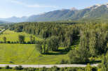 Discover this stunning property nestled amidst a lush forest with breathtaking mountain views.