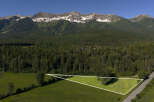 Discover this prime parcel of land offering breathtaking mountain views and a serene forested backdrop.