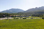 Discover this prime real estate opportunity nestled against a backdrop of majestic mountains and lush greenery.