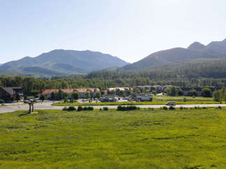 Discover this prime real estate opportunity nestled against a backdrop of majestic mountains and lush greenery.