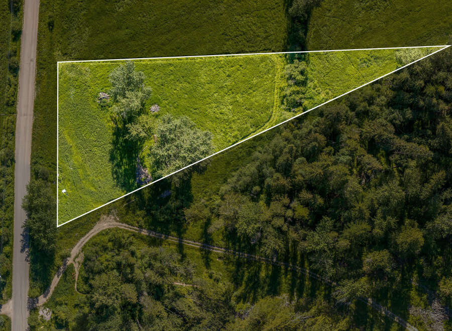 Discover this prime parcel of land, offering a unique blend of open, sun-drenched meadow and dense, mature woodland.
