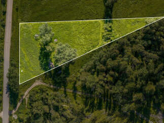 Discover this prime parcel of land, offering a unique blend of open, sun-drenched meadow and dense, mature woodland.