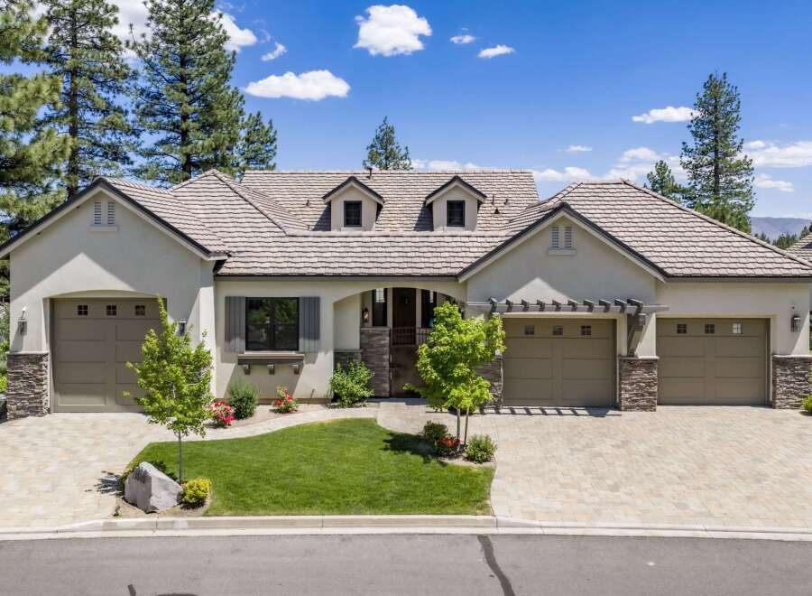 Discover this stunning single-story home featuring a charming courtyard entrance and a spacious three-car garage.