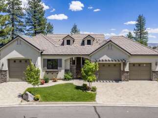 Discover this stunning single-story home featuring a charming courtyard entrance and a spacious three-car garage.