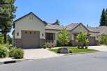 Discover this stunning home featuring a modern stucco exterior with stone accents and a durable tile roof.