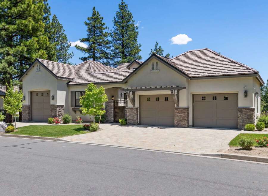 Discover this stunning single-story home featuring a modern stucco exterior and a welcoming courtyard entrance.