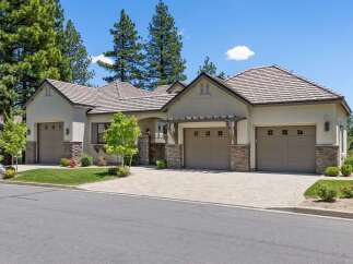 Discover this stunning single-story home featuring a modern stucco exterior and a welcoming courtyard entrance.