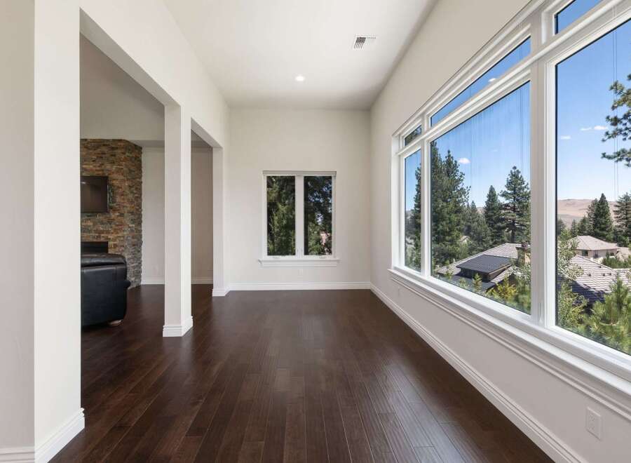Experience breathtaking views from this stunning home, featuring expansive windows that flood the space with natural light.