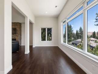 Experience breathtaking views from this stunning home, featuring expansive windows that flood the space with natural light.