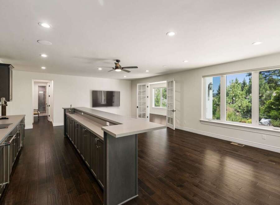 Experience modern living in this spacious home featuring a sleek wet bar perfect for entertaining.