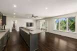 Experience modern living in this spacious home featuring a sleek wet bar perfect for entertaining.