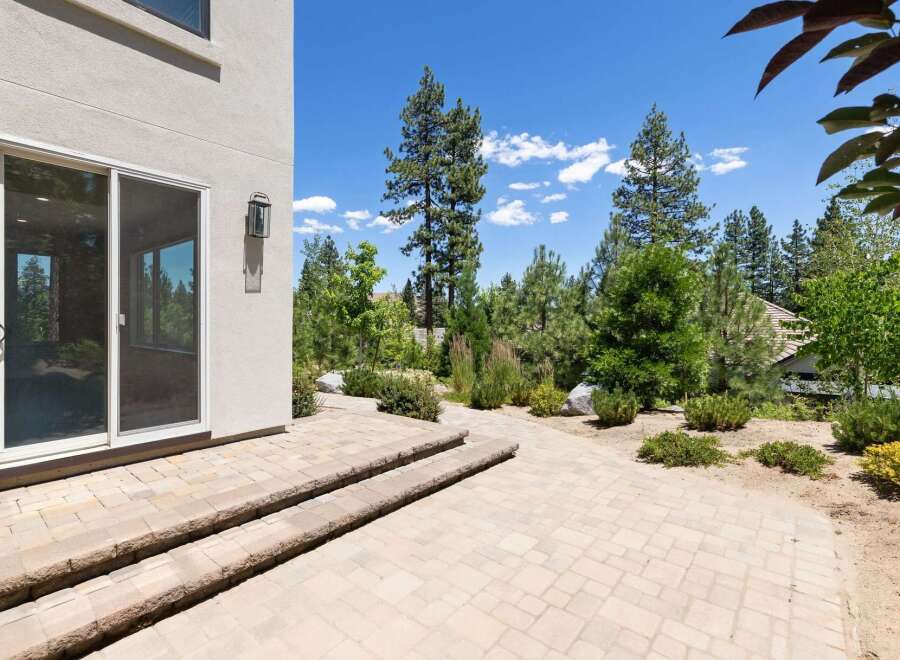 Step outside to a beautifully paved patio area, perfect for enjoying the serene surroundings.