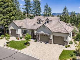 Discover this stunning single-family home featuring a spacious three-car garage and a beautifully paved driveway.