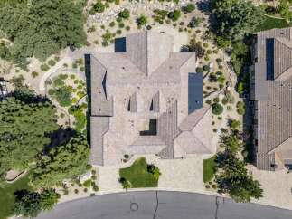 Experience luxury living in this stunning aerial view of a sprawling estate.