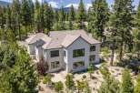Experience luxury living in this stunning modern home nestled among mature pine trees.