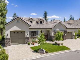 Discover this stunning single-family home featuring a modern stucco exterior with stone accents and a durable tile roof.