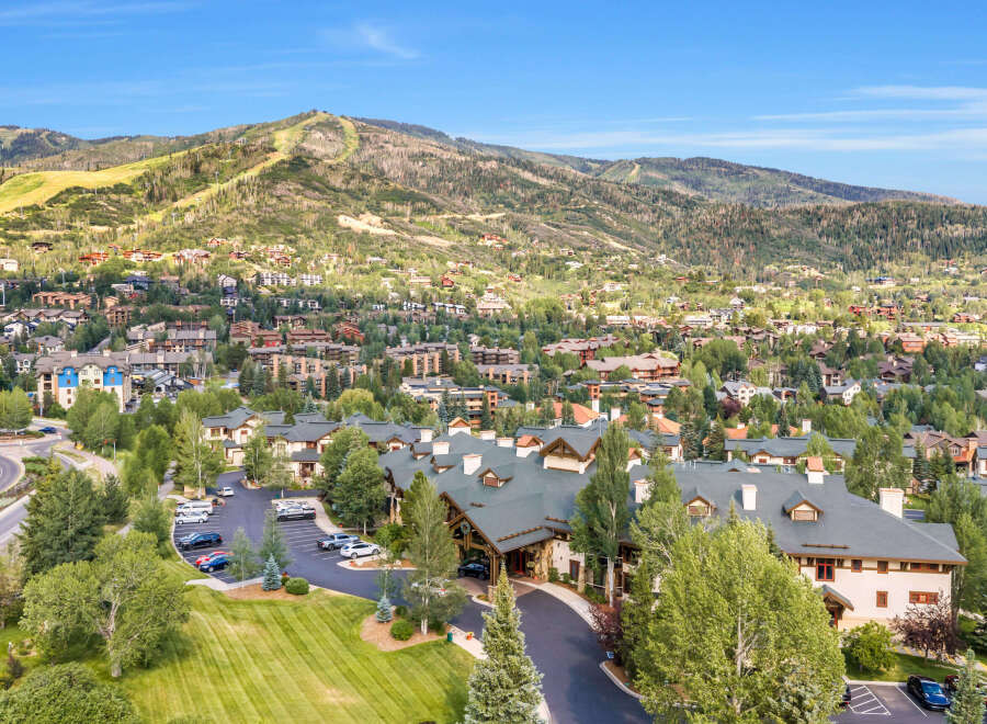 Experience luxury mountain living in this stunning property nestled amidst the scenic beauty of a ski resort town.