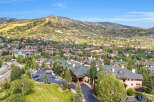 Experience luxury mountain living in this stunning property nestled amidst the scenic beauty of a ski resort town.