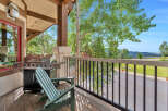 Enjoy outdoor living on this charming covered porch, complete with a stainless steel grill perfect for summer cookouts.