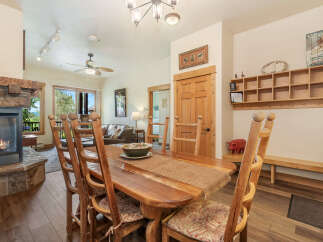 Gather around the rustic dining table, perfect for family meals after a day of adventure.