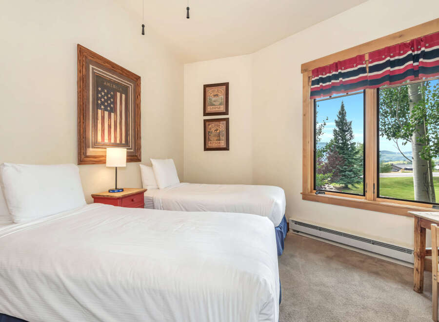 This charming bedroom features two comfortable twin beds, perfect for accommodating guests or family.