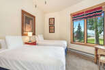 This charming bedroom features two comfortable twin beds, perfect for accommodating guests or family.