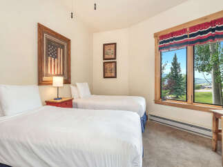 This charming bedroom features two comfortable twin beds, perfect for accommodating guests or family.