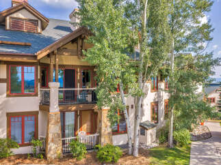 Experience mountain living in this charming property featuring a multi-level design with balconies offering scenic views.