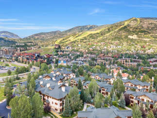 Discover this stunning mountain resort property, offering a picturesque setting amidst lush greenery and rolling hills.
