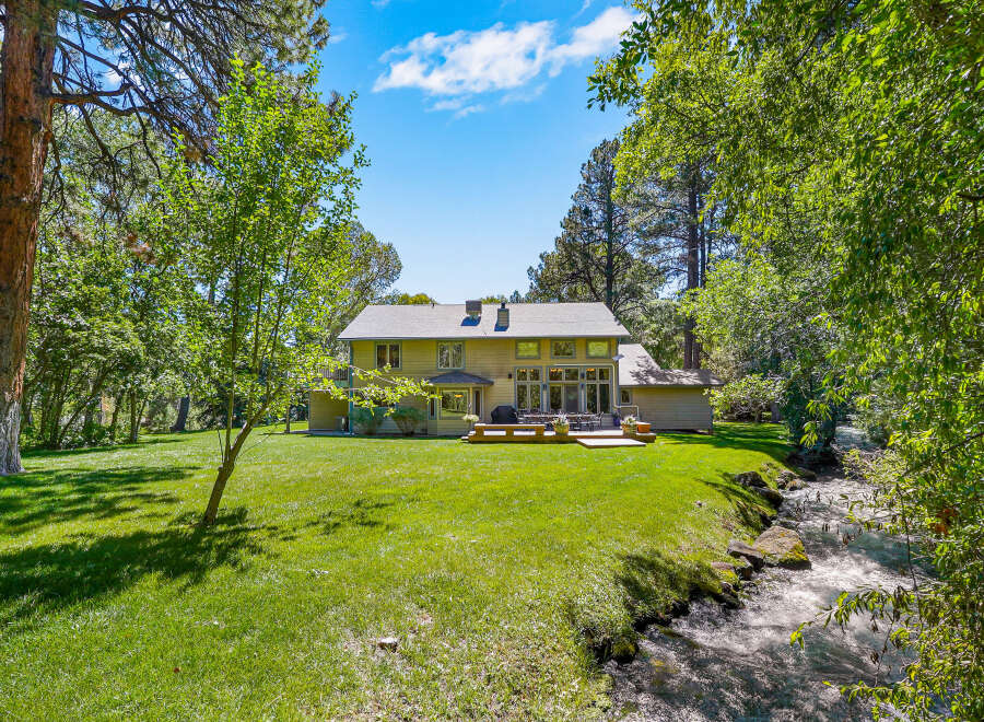 Experience serene living with this stunning property featuring a spacious backyard and a tranquil creek.