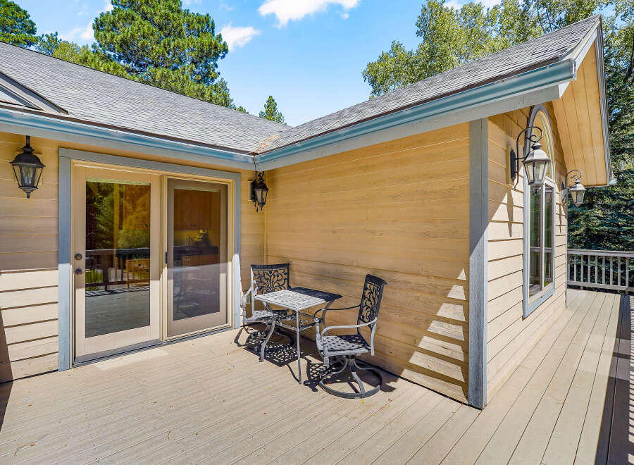 Enjoy outdoor living on this spacious deck, perfect for morning coffee or evening relaxation.