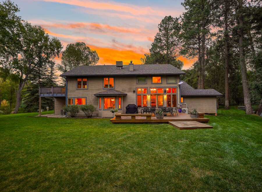 Experience luxurious living in this stunning home featuring a spacious backyard with a multi-level deck perfect for entertaining.