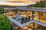 Experience luxury living with this stunning modern home featuring expansive glass walls and breathtaking mountain views.