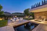 Experience luxury outdoor living with this stunning modern backyard featuring a sleek plunge pool and a sophisticated seating area.