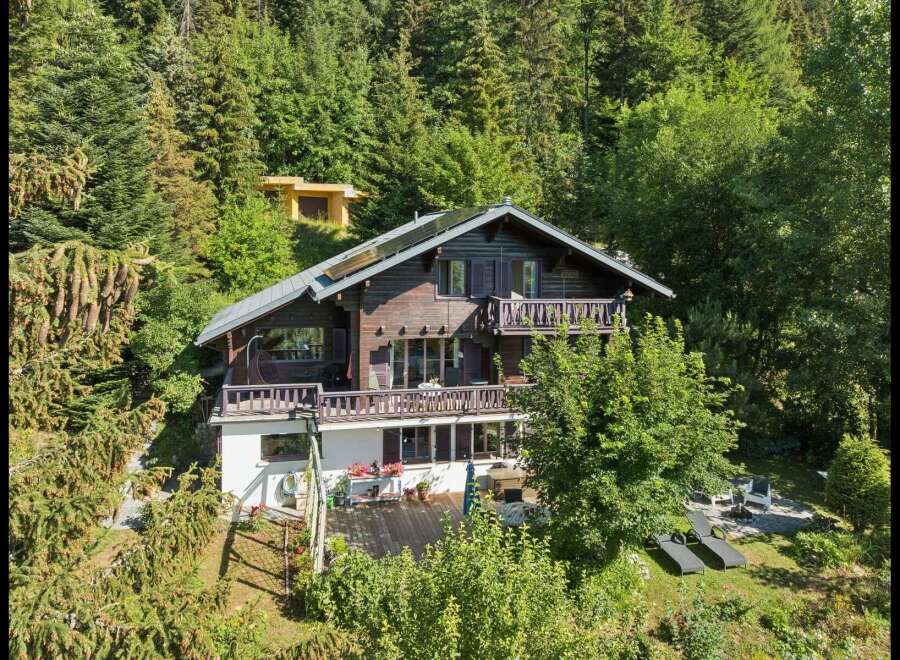 Nestled amidst a lush forest, this charming wooden chalet offers a serene mountain retreat.