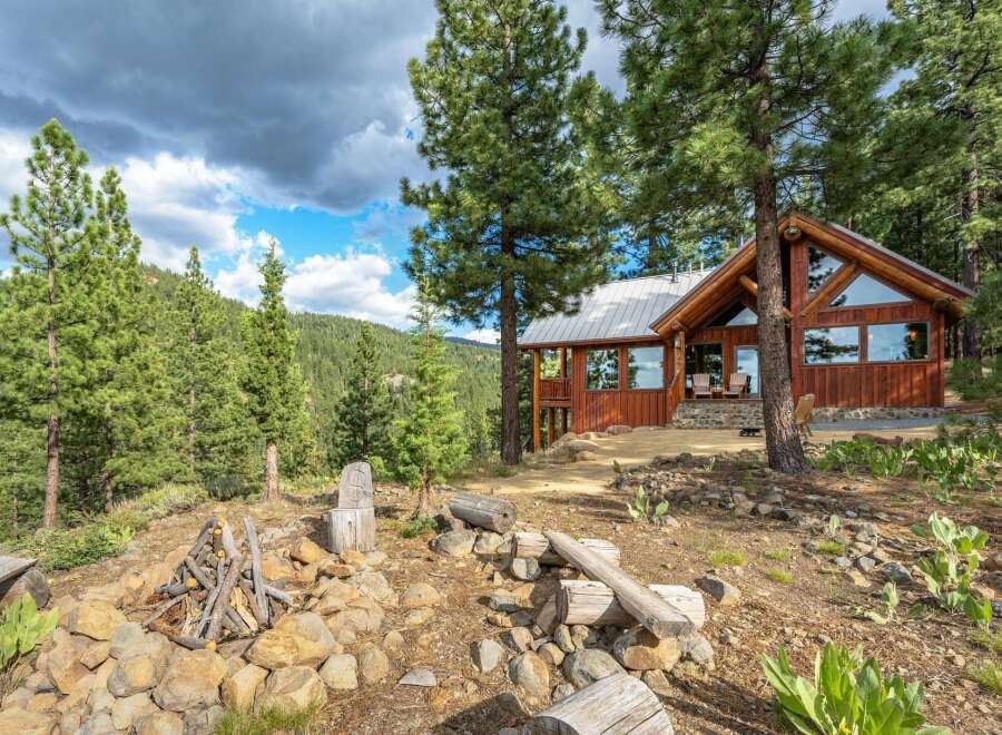 Experience rustic charm and breathtaking mountain views from this stunning log cabin.