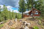 Experience rustic charm and breathtaking mountain views from this stunning log cabin.