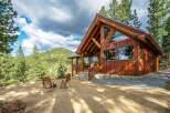 Experience rustic charm and modern comfort in this stunning log cabin nestled amidst a picturesque mountain landscape.