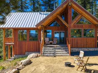 Experience rustic charm and modern comfort in this stunning log cabin nestled amidst a serene forest landscape.