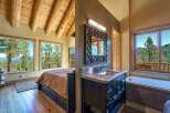 Experience breathtaking mountain views from this stunning bedroom and bathroom suite.