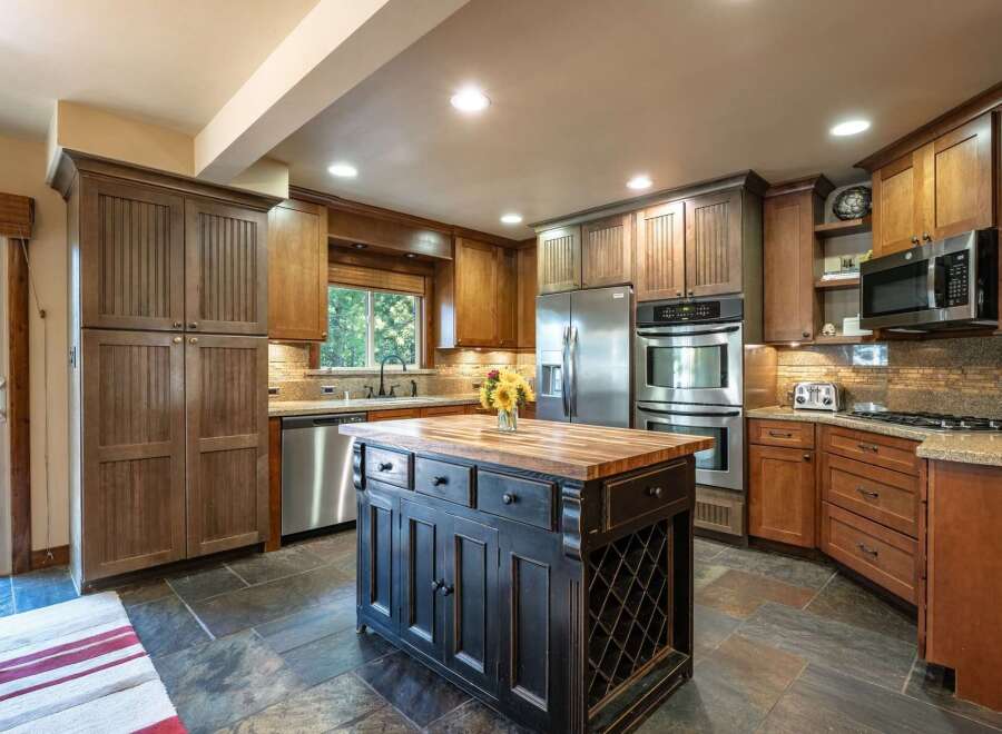 Experience the perfect blend of rustic charm and modern convenience in this stunning kitchen.