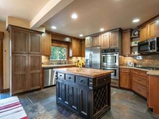 Experience the perfect blend of rustic charm and modern convenience in this stunning kitchen.