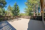Enjoy the serene mountain views from this spacious deck, perfect for outdoor entertaining or quiet relaxation.