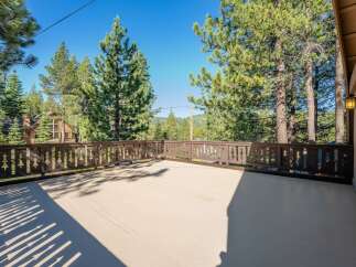 Enjoy the serene mountain views from this spacious deck, perfect for outdoor entertaining or quiet relaxation.
