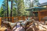 Enjoy the serene mountain lifestyle on this spacious wooden deck, perfect for outdoor entertaining.