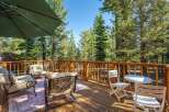 Enjoy the serene mountain views from this spacious wooden deck, perfect for outdoor entertaining or quiet relaxation.
