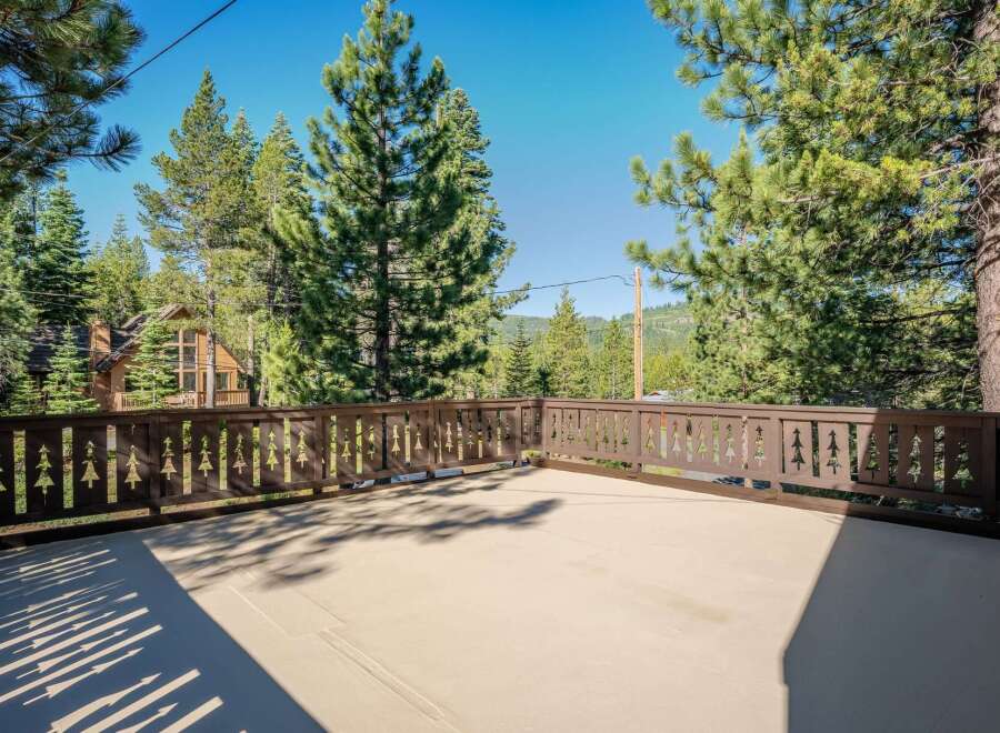 Enjoy the serene mountain views from this spacious deck, perfect for outdoor entertaining or quiet relaxation.